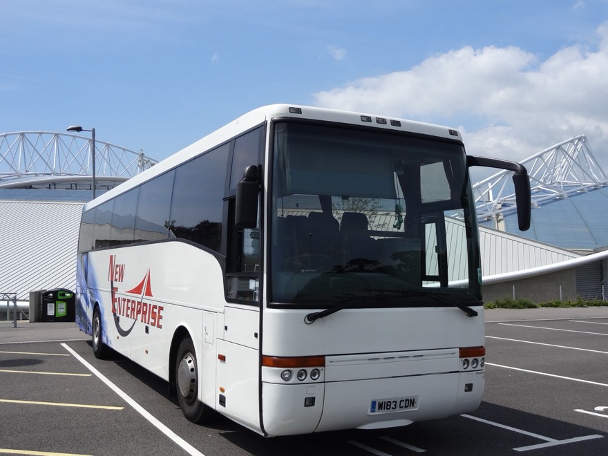A New Enterprise coach at Falmer Stadium, East Sussex, for a Rod Stewart concert. It is a DAF SB3000 coach with Van Hool T9 Alizée C52F body, registration mark 