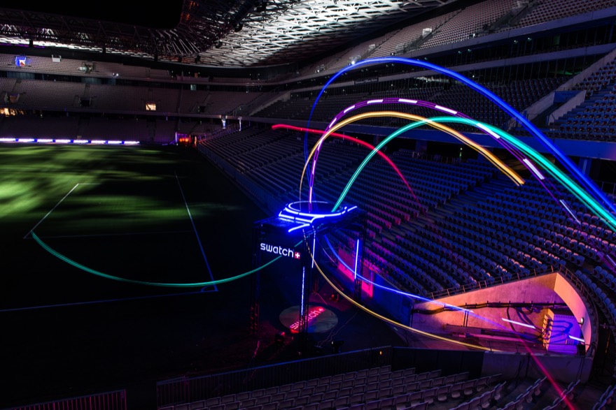 The image depicts DRL drones racing through the Swatch gate during Level 5: Allianz Riviera in the 2018 DRL Allianz World Championship Season.