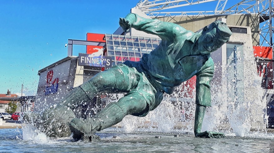 "The Splash", a statue of English footballer Sir Tom Finney located in front of the Deepdale football stadium, Preston.